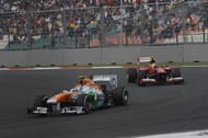 Sahara Force India driver Adrian Sutil and Scuderia Ferarri driver Felipe Massa in action
