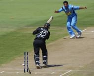 Brendon McCullum of New Zealand is bowled out by Zaheer Khan of India