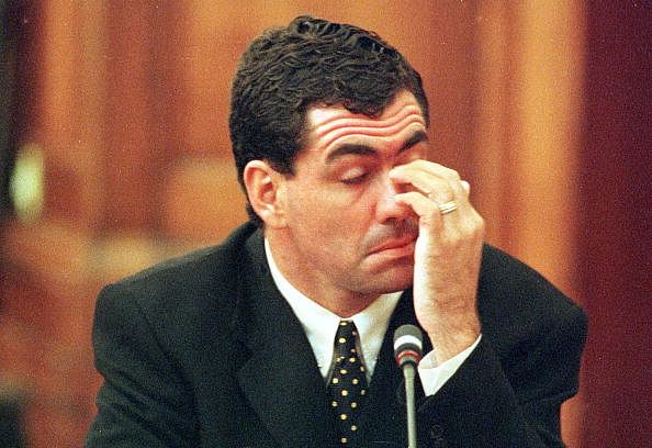 Sacked South African cricket captain Hansie Cronje wipes his eye  during his cross-examination at the King Commission of Inquiry into allegations of cricket match-fixing (23 June 2000).  Cronje later broke down and left the hearings in tears at the conclusion of his testimony.