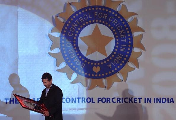Indian cricketer Sachin Tendulkar holds