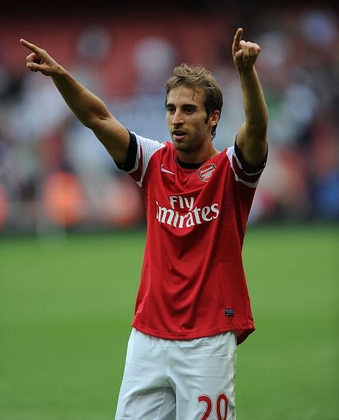 Mathieu Flamini celebrates after the Barclays Premier League match between Arsenal and Tottenham Hotspur at Emirates Stadium on September 01, 2013 in London, England.  (Getty Images)