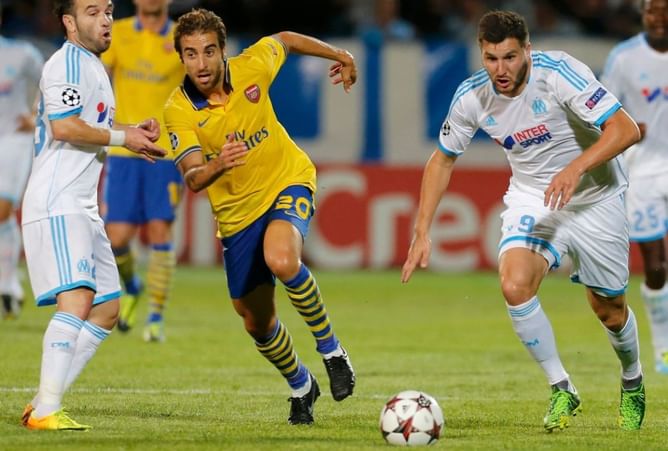 Arsenal left dented as Flamini is 'major doubt' for Dortmund game