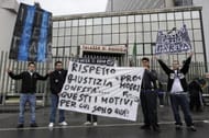 Juventus football supporters display a banner reading 'Respect, Justice, Honesty, that's why we are here' against football club Inter Milan outside the Naples court palace on April 13, 2010 as former Juventus Football Club general manager Luciano Moggi (unseen) is set to face a court case over his alleged involvement in a 2006 corruption scandal