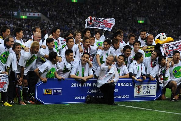 Alberto Zaccheroni, coach of Japan, leads the celebrations with the squad after the FIFA World Cup qualifier against Australia at Saitama Stadium on June 4, 2013 in Saitama, Japan.  (Getty Images)