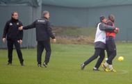 Roberto Mancini and Mario Balotelli are seperated after almost striking one another.
