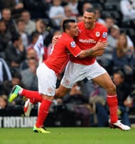 Steven Caulker (R) celebrates scoring his team's first goal with team-mate Gary Medel (L) during the Barclays Premier League match between Fulham and Cardiff City at Craven Cottage on September 28, 2013 in London, England. (Getty Images)