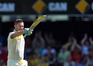 Michael Clarke salutes the dressing room after his hundred
