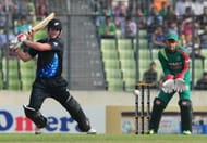 New Zealand batsman Colin Munro (L) plays a shot.