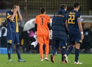 VERONA, ITALY - NOVEMBER 23: Vangelis Moras (L) Hellas Verona FC shows his dejection after the Serie A match between Hellas Verona FC and AC Chievo Verona at Stadio Marc'Antonio Bentegodi on November 23, 2013 in Verona, Italy.