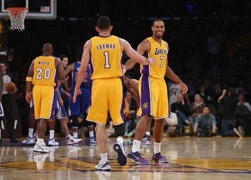 Xavier Henry #7 and Jordan Farmar #1 of the Los Angeles Lakers celebrate against the Los Angeles Clippers in the second half at Staples Center.