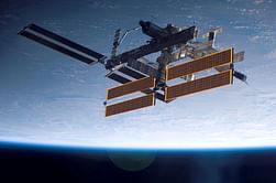 Russian cosmonauts take Olympic torch on maiden spacewalk