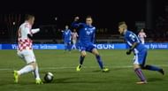 Ivica Olic (L) vies for the ball with Iceland's midfielder Gylfi Thor Sigurdsson (C) and Iceland's defender Ari Freyr Skulason