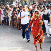 61-year-old woman clad in sari and running barefoot wins race at Baramati Marathon