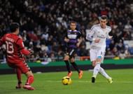 Gareth Bale of Real Madrid CF scores Real's 4th goal and his hat-trick past Diego Marino of Real Valladolic CF.