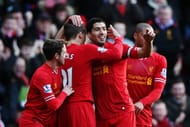 LIVERPOOL, ENGLAND - DECEMBER 21: Luis Suarez (2nd right) of Liverpool celebrates with team mates after scoring during the Barclays Premier League match between Liverpool and Cardiff City at Anfield on December 21, 2013 in Liverpool, England. (Photo by Clive Brunskill/Getty Images)