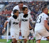 HULL, ENGLAND - DECEMBER 26: Wayne Rooney; Javier "Chicharito" Hernandez and Adnan Januzaj of Manchester United celebrate James Chester of Hull City scoring an own goal during the Barclays Premier League match between Hull City and Manchester United at KC Stadium on December 26, 2013 in Hull, England. (Photo by Matthew Peters/Man Utd via Getty Images)