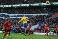 CARDIFF, WALES - NOVEMBER 30: Aaron Ramsey heads past Cardiff goalkeeper David Marshall to score for Arsenal at Cardiff City Stadium on November 30, 2013 in Cardiff, Wales. (Photo by Stuart MacFarlane/Arsenal FC via Getty Images)