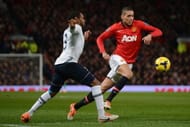 MANCHESTER, ENGLAND - JANUARY 01: Chris Smalling of Manchester United competes with Danny Rose of Tottenham Hotspur during the Barclays Premier League match between Manchester United and Tottenham Hotspur at Old Trafford on January 1, 2014 in Manchester, England. (Photo by Michael Regan/Getty Images)