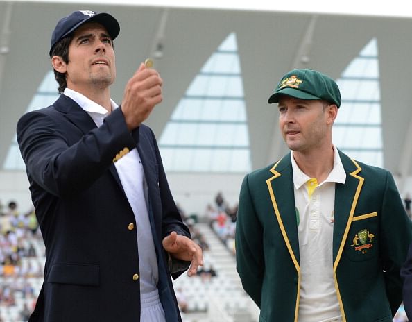 England captain Alistair Cook (L) tosses the coin as Australia&#039;s Michael Clarke looks on during the first days play of the first cricket Test match of the 2013 Ashes series between England and Australia at Trent Bridge in Nottingham, central England on July 10, 2013. England captain Alastair Cook won the toss and elected to bat in the first Ashes Test despite overcast conditions at Trent Bridge as Australia sprang a major surprise by giving a debut to teenage spinner Ashton Agar.AFP PHOTO/POOL/PHILIP BROWN - RESTRICTED TO EDITORIAL USE. NO ASSOCIATION WITH DIRECT COMPETITOR OF SPONSOR, PARTNER, OR SUPPLIER OF THE ECB        (Photo credit should read Philip Brown/AFP/Getty Images)