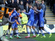 Eden Hazard of Chelsea (L) celebrates the scoring the opening goal with Willian during the Barclays Premier League match between Hull City and Chelsea at the KC Stadium on January 11, 2014 in Hull, England.