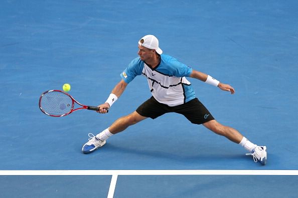 Lleyton Hewitt in action during his 5-set loss to Andreas Seppi on Day 2 of the 2014 Australian Open