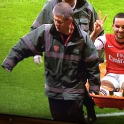Arsene Wenger defends injured Theo Walcott for his 'non-offensive' gesture