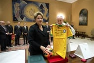 Pope Francis exchanges gifts with Brazilian President Dilma Rousseff during their audience at the Vatican City on