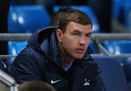 Dzeko awaits his turn on the pitch