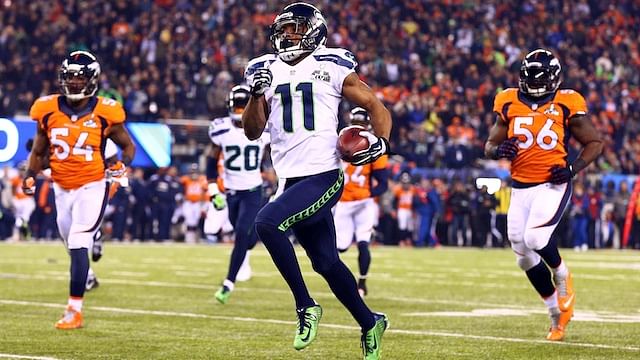 Percy Harvin (#11) returns the second half kickoff for a touchdown in Super Bowl XLVIII (credit: rantsports.com)
