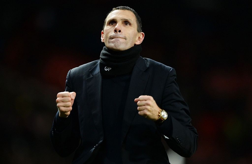 Sunderland&#039;s manager Gus Poyet celebrates after their penalty shootout win against Manchester United after their English League Cup semi-final second leg soccer match at Old Trafford