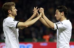 Thomas Muller backs up Arsenal’s Mesut Özil