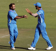 Amit Mishra(L) with Virat Kohli