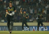 Shahid Afridi of Pakistan celebrates after running out Mitchell Starc (L) of Australia during the ICC World Twenty20 Bangladesh 2014 match between Australia and Pakistan at Sher-e-Bangla Mirpur Stadium on March 23, 2014 in Dhaka, Bangladesh.