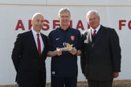 Chairman Sir Chips Keswick and CEO Ivan Gazidis present Arsene Wenger with a gold cannon to commemorate his 1000th game as Arsenal manager