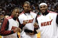 Dwyane Wade #3, Chris Bosh #1 and LeBron James #6 of the Miami Heat pose with their 2012 NBA Championship rings