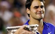 Emotional: Roger Federer cries as he watches Nadal being handed the trophy