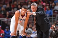 Brett Brown of the Philadelphia 76ers talks with Michael Carter-Williams during a game. Is he asking him to deliberately underperform?