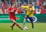 Philipp Lahm challenges Alex Oxlade-Chamberlain