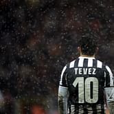Why is Carlos Tevez not playing for Argentina?