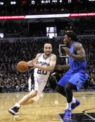 Manu Ginobili #20 of the San Antonio Spurs drives around Jae Crowder #9 of the Dallas Mavericks in Game One of the Western Conference Quarterfinals during the 2014 NBA Playoffs at the AT&T Center on April 20, 2014 in San Antonio, Texas