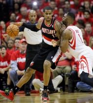 LaMarcus Aldridge #12 of the Portland Trail Blazers backs in on Terrence Jones #6 of the Houston Rockets in Game One of the Western Conference Quarterfinals during the 2014 NBA Playoffs at the Toyota Center on April 20, 2014 in Houston, Texas