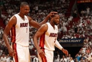 Chris Bosh #1 and Dwyane Wade #3 of the Miami Heat celebrate against the Charlotte Bobcats during Game One of the Eastern Conference Quarterfinals of the 2014 NBA playoffs at the American Airlines Arena in Miami, Florida on April 20, 2014