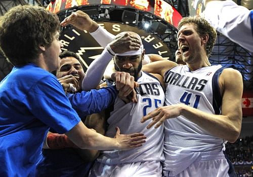 The Dallas Mavericks' Vince Carter and teammate Dirk Nowitzki, right, celebrate following Carter's game-winning three-point shot against the San Antonio Spurs in Game 3 of of a Western Conference quarterfinal at the American Airlines Center in Dallas on Saturday, April 26, 2014. Carter's jumper as time expired lifted the Mavs to a 109-108 win and a 2-1 series lead. 