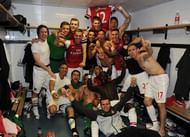 Arsenal players celebrating after winning race to fourth spot with Spurs
