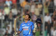 Indian batsman Sachin Tendulkar reacts after scoring his hundred century during the one day international (ODI) Asia Cup cricket match between India and Bangladesh at the Sher-e-Bangla National Cricket Stadium in Dhaka on March 16, 2012. India's Sachin Tendulkar became the first batsman in history to score 100 international centuries, adding another milestone in his record-breaking career. AFP PHOTO/Munir uz ZAMAN (Photo credit should read MUNIR UZ ZAMAN/AFP/Getty Images)