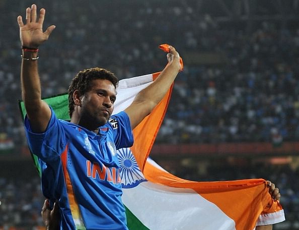Indian cricketer Sachin Tendulkar waves the tricolor while celebrating victory during the final of ICC Cricket world Cup 2011 match between India and Sri Lanka at The Wankhede Stadium in Mumbai on April 2, 2011.India beat Sri Lanka by six wickets.  AFP PHOTO/Prakash SINGH (Photo credit should read PRAKASH SINGH/AFP/Getty Images)