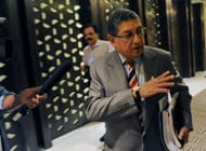 International Cricket Council (ICC) Chairman N. Srinivasan of India (C) gestures after attending a board meeting in Singapore on February 8, 2014. The International Cricket Council board on February 8 approved wide-ranging structural and governance reforms despite complaints that they place too much power in the hands of the "Big Three" of India, England and Australia. AFP PHOTO/ROSLAN RAHMAN (Photo credit should read ROSLAN RAHMAN/AFP/Getty Images)