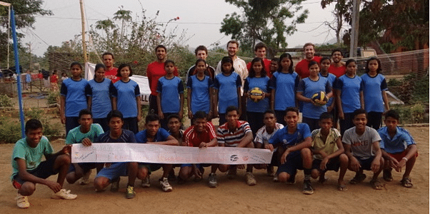 The boys and girls of the Kankia teams alongside staff at the Khel Vikas Volleyball Exhibition celebrating International Day of Sport for Development and Peace.