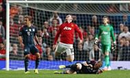 Bastian Schweinsteiger tackles Wayne Rooney
