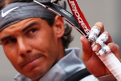 A shot of Rafael Nadal of Spain's fingers taped up before his match against Juan Monaco of Argentina during day five of the Mutua Madrid Open tennis tournament at the Caja Magica on May 7, 2014 in Madrid, Spain.  